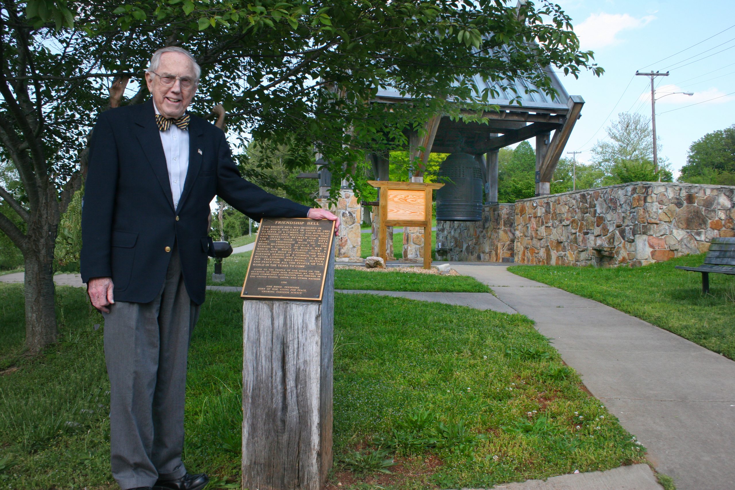 The late Bill Wilcox by the Friendship Bell. Courtesy of the Friends of the International Friendship Bell.
